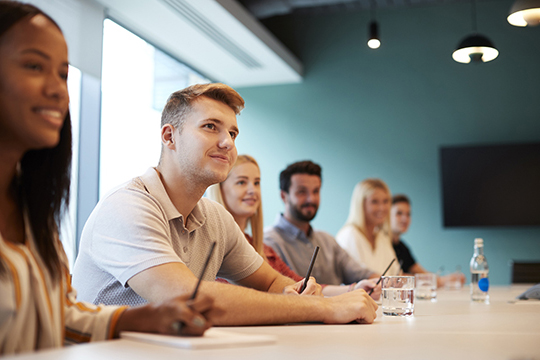 Interns listening to a presentation