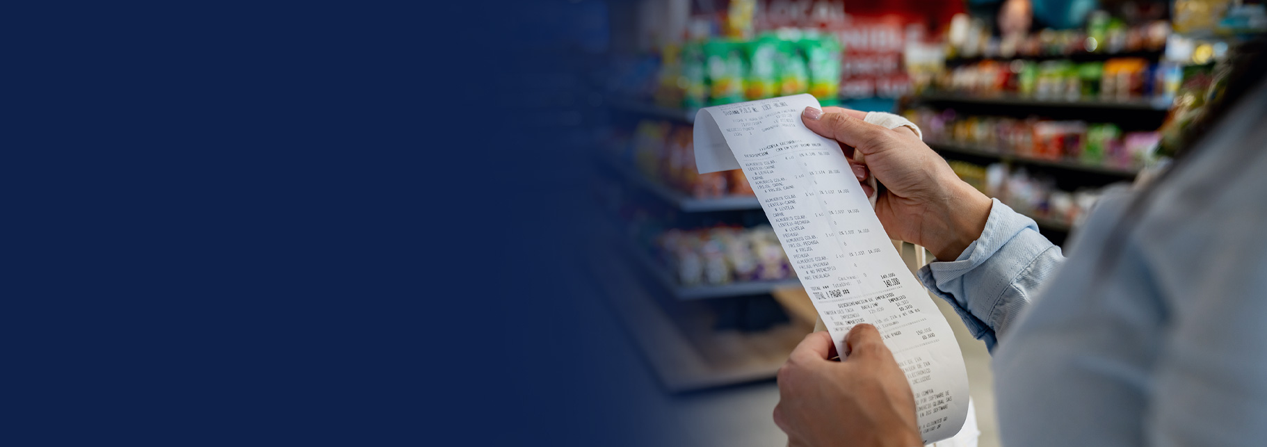 person shopping at a convenience store and checking their receipt