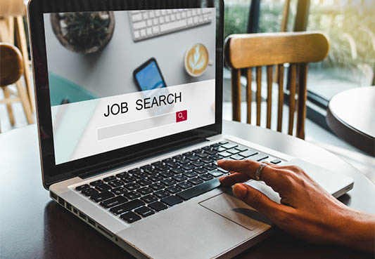 Laptop open with the words Job Search 