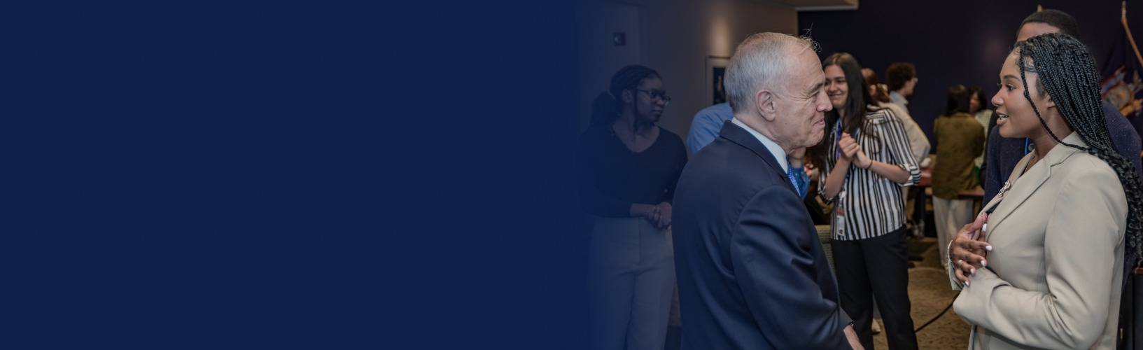 new york state comptroller dinapoli talking to a person at an event