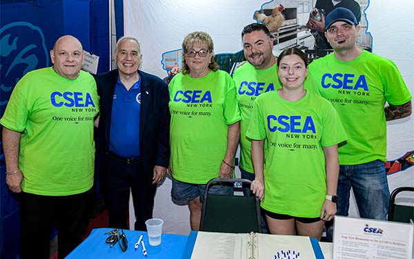 new york state comptroller thomas p. dinapoli and representatives from the civil service employees association at the new york state fair