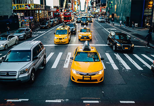Cars and taxis on city street