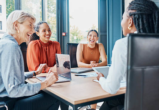 People sitting at table in boardroom