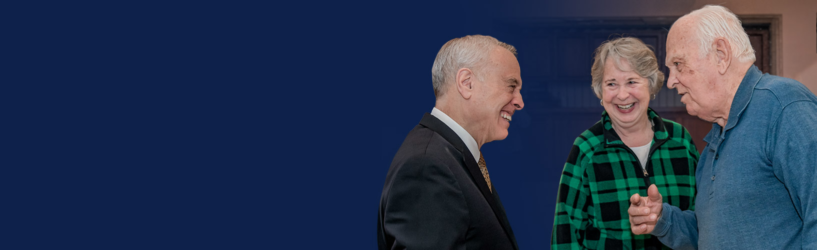 state comptroller dinapoli having a conversation with two new york state retirees