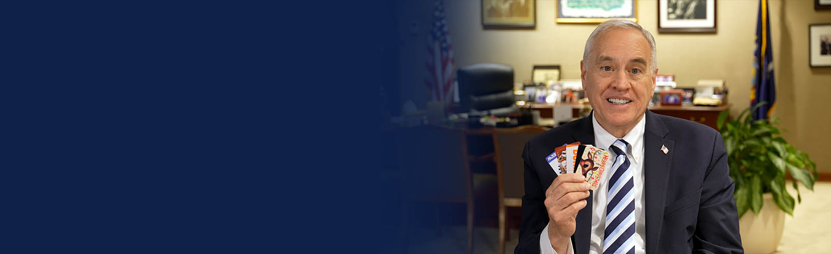 State Comptroller DiNapoli holding gift cards
