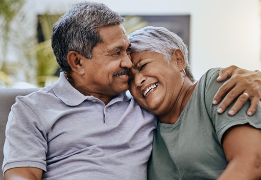 Elderly couple sitting next to each other