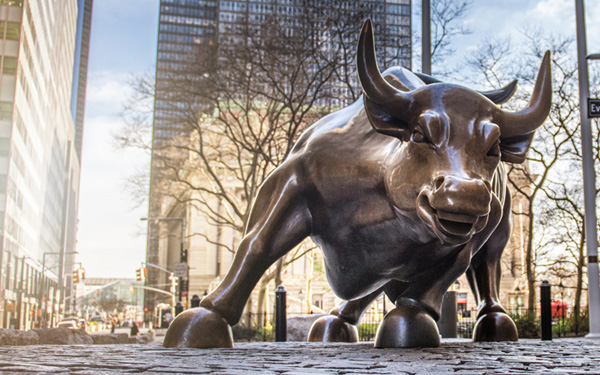 Charging Bull sculpture on empty streets of New York City.