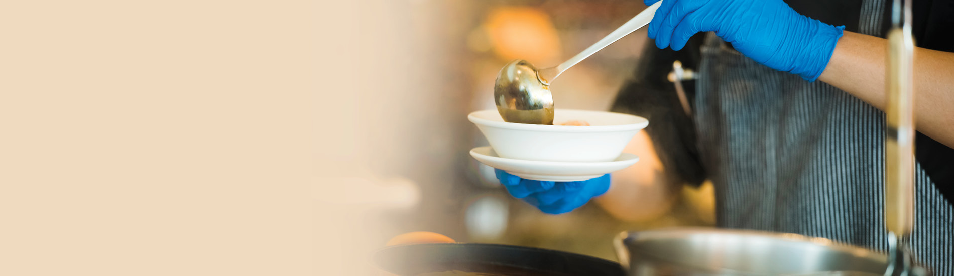 Soup being ladled into a bowl