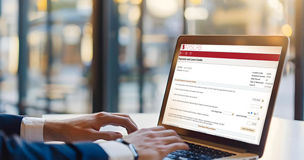 person viewing aplc page on laptop