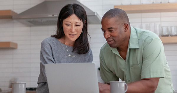 Couple looking at laptop