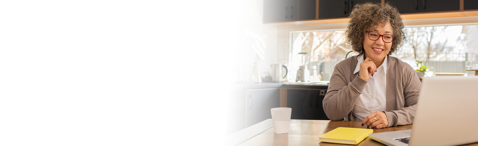 woman smiling at laptop