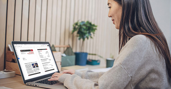 woman at computer looking at member annual statement