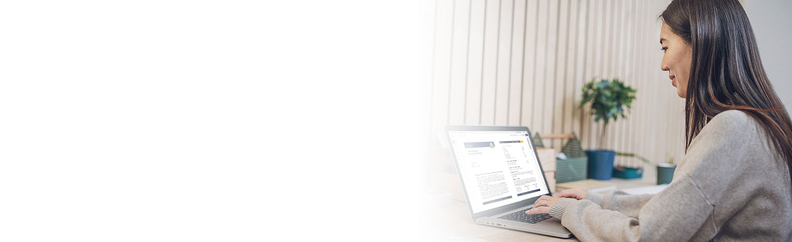 Woman looking at Member Annual Statement on laptop