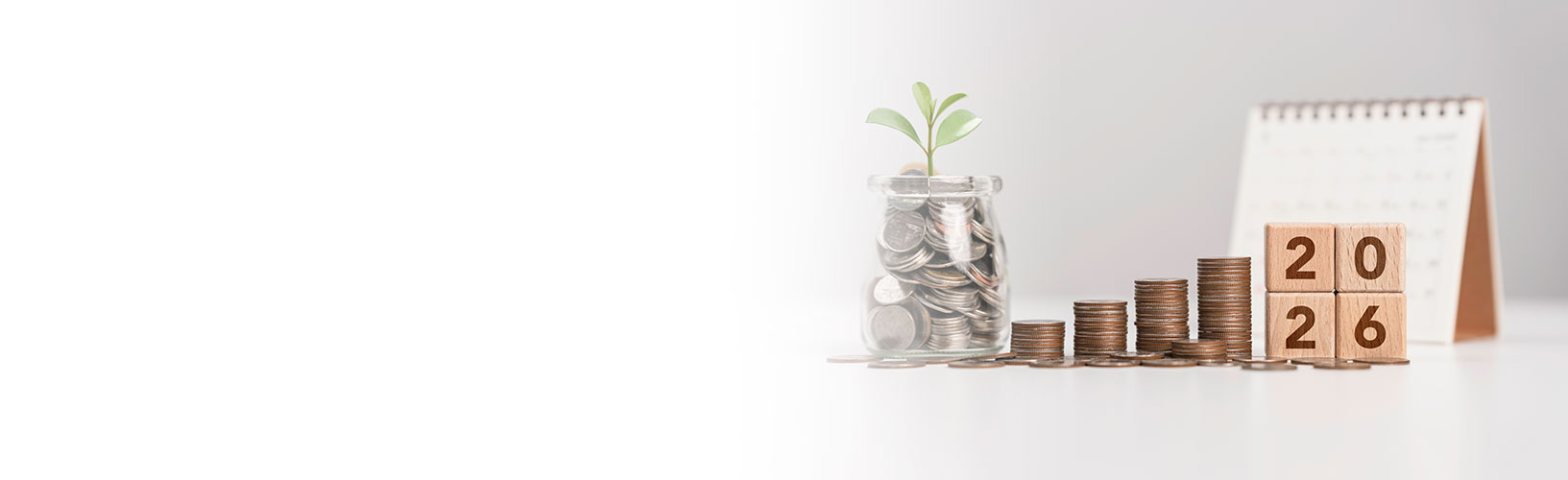 jar with coins rising stacks of coins calendar with 2026