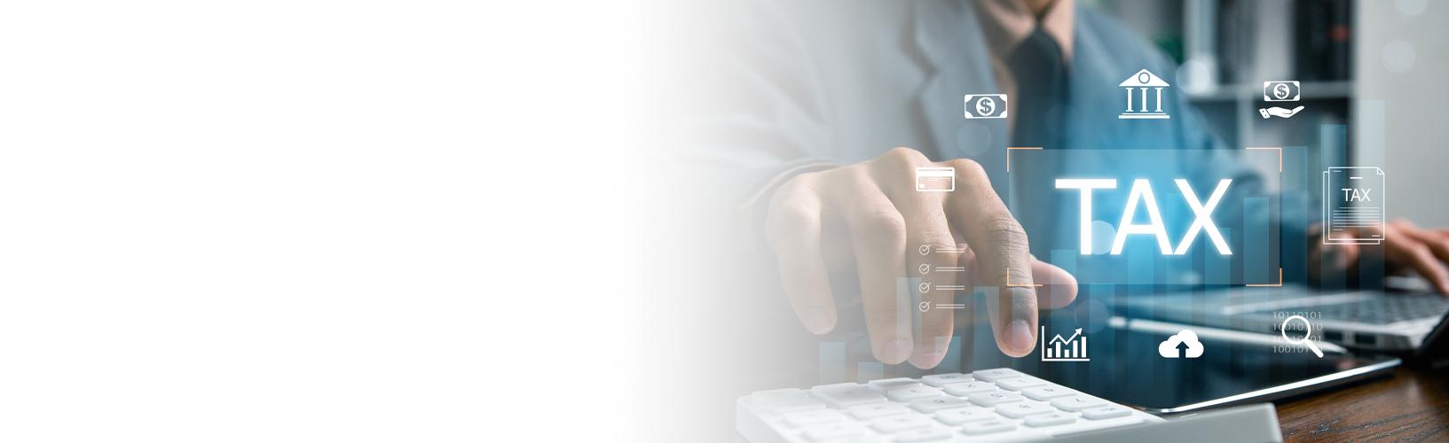 Man using laptop and calculator with the word TAX overlayed