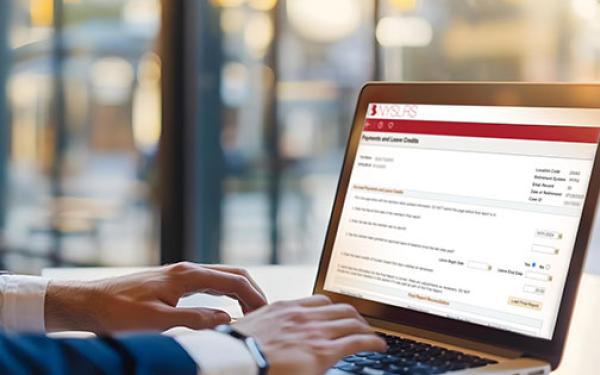 person viewing aplc page on laptop