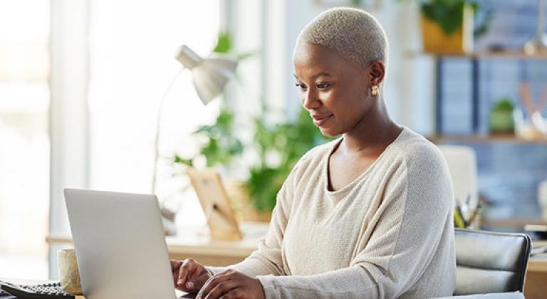 woman confidently using laptop