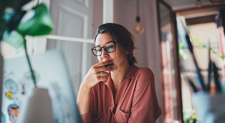 woman looking at laptop