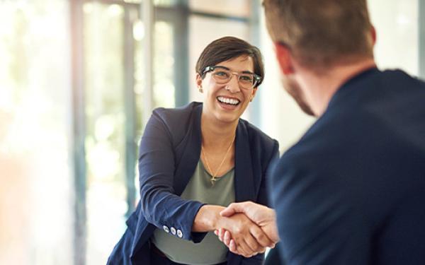 Woman shaking hand warm welcome