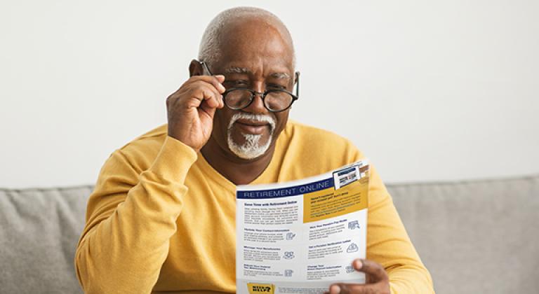 retiree reading the retiree notes newsletter