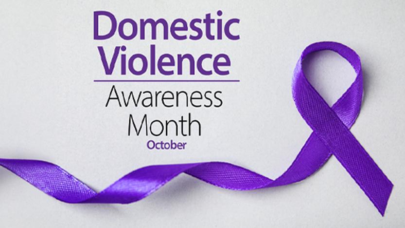 Purple ribbon on grey background, top view. Symbol of Domestic Violence Awareness