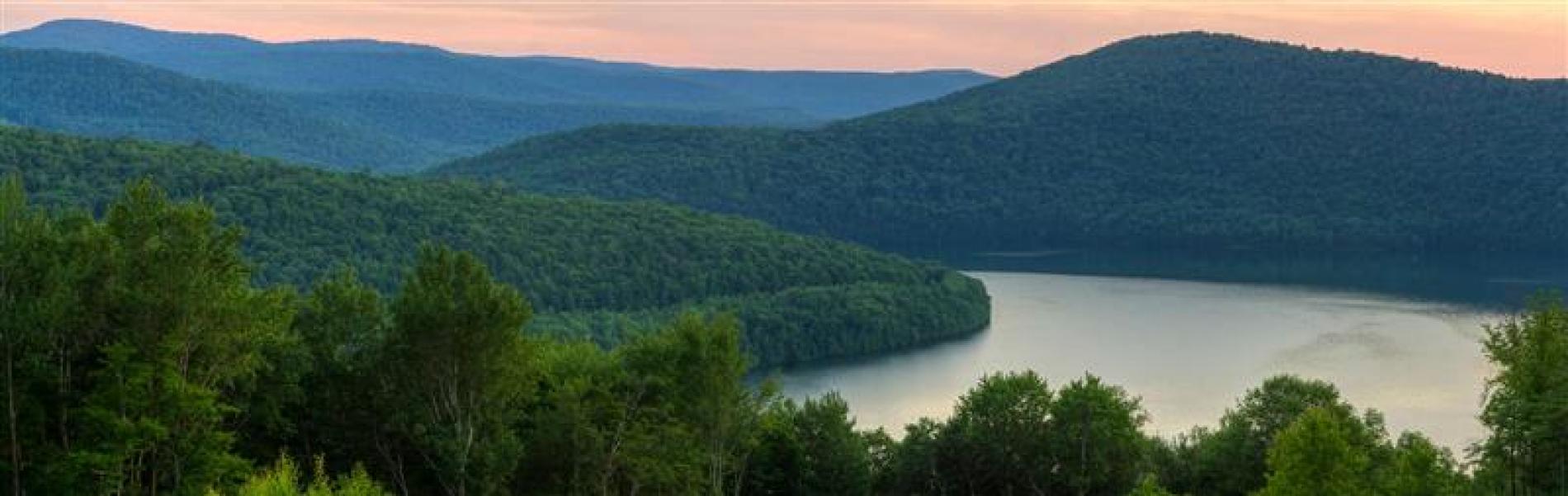 Scenic view of mountains and a river.