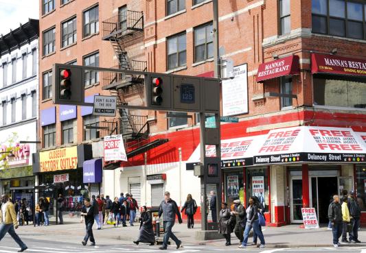 city street with people shopping at local businesses
