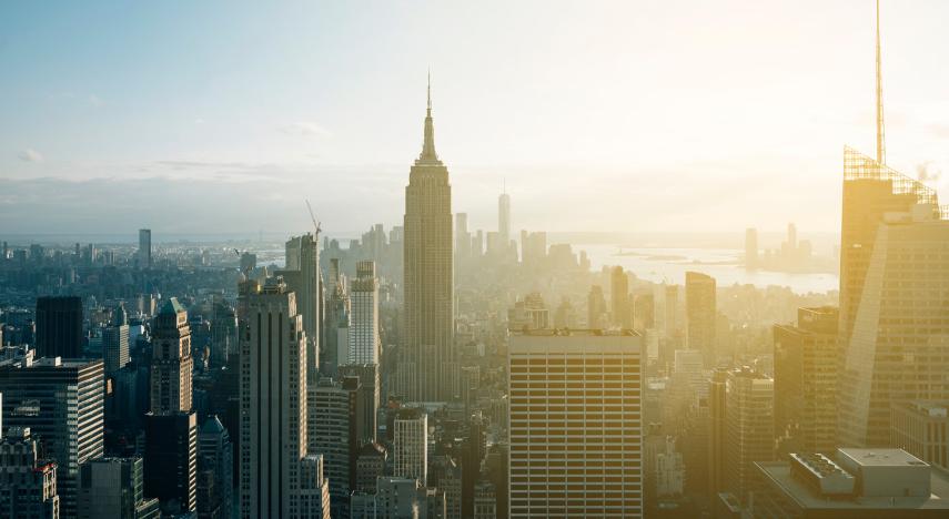 new york city skyline drone shot with the empire state building in the center of the frame